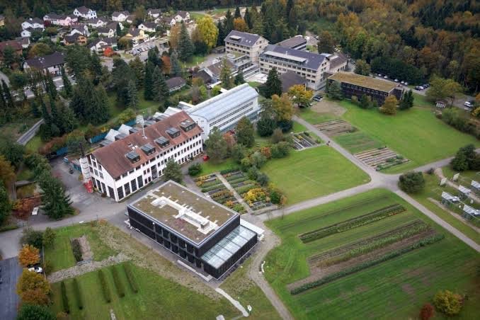 Aerial view of the WSL research campus at Birmensdorf, showing laboratory buildings alongside experimental planting plots